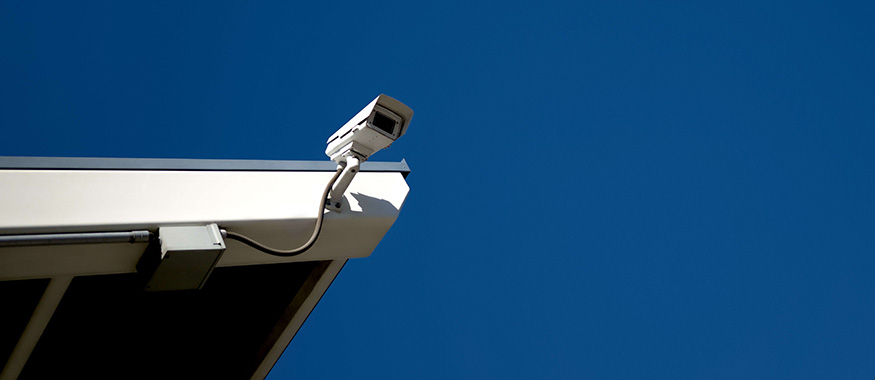 Video surveillance camera mounted on roof.